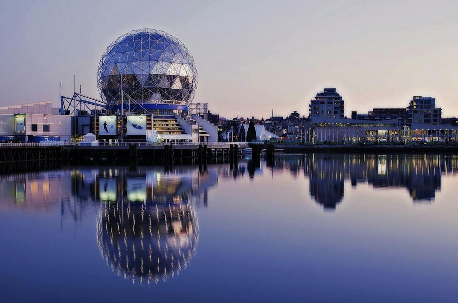 grey dome building beside body of water during sunset Murder, Money, and Real Estate: The Mystery Behind a $113 Million Vancouver Scam
