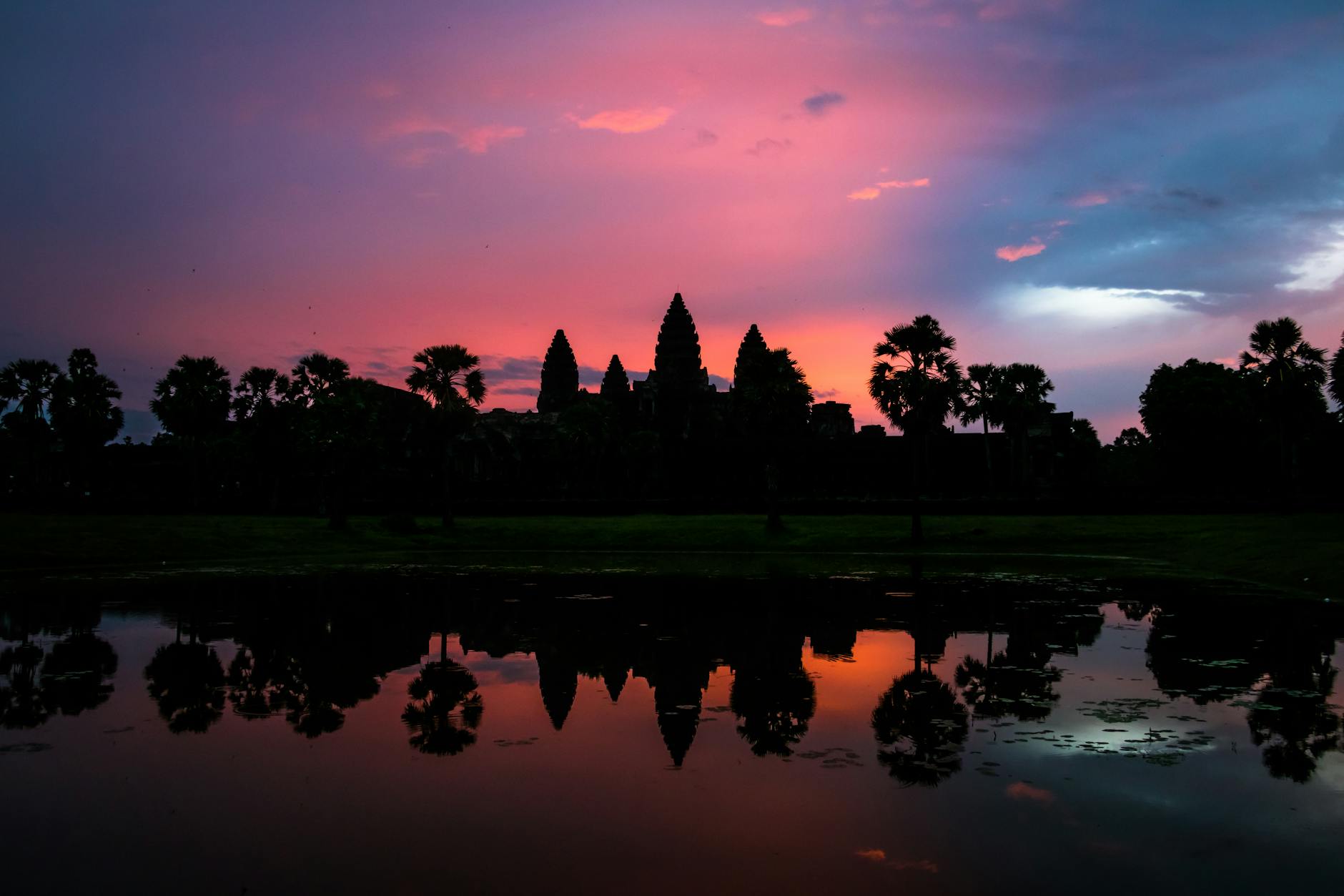 silhouette of trees near body of water Cambodia