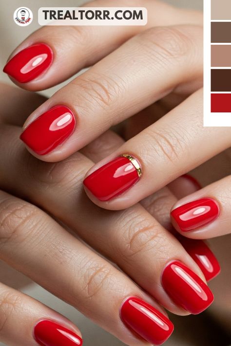 A close-up of hands with vibrant red nails and a glossy finish, with a subtle gold ring, exuding a classic and elegant style
