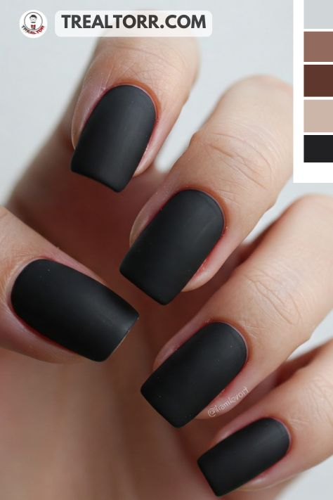 A set of matte black nails with a smooth finish, giving off a sleek, trendy, and edgy vibe.