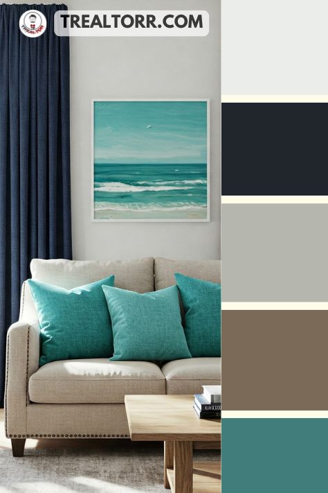 A living room with turquoise throw pillows, deep navy curtains, and white walls accented with aqua decor, evoking an ocean-inspired ambiance
