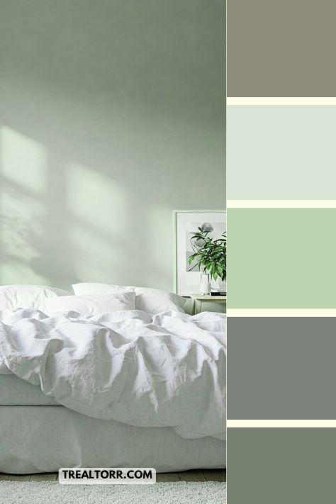 A bedroom with soft sage green walls, white bedding, and light wood furniture, creating a fresh, calming atmosphere