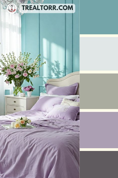 A bedroom with aqua walls, soft lilac bedding, and white furniture, decorated with fresh flowers for a light and airy feel